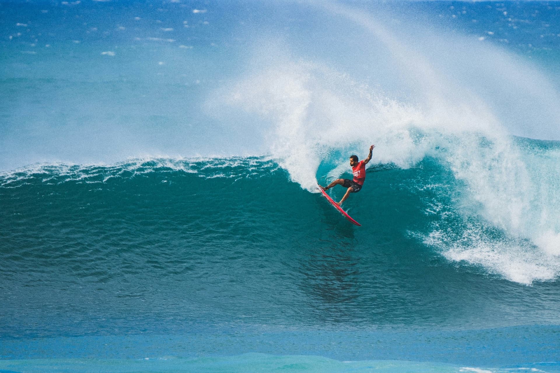Surfer performing a radical snap on the leap